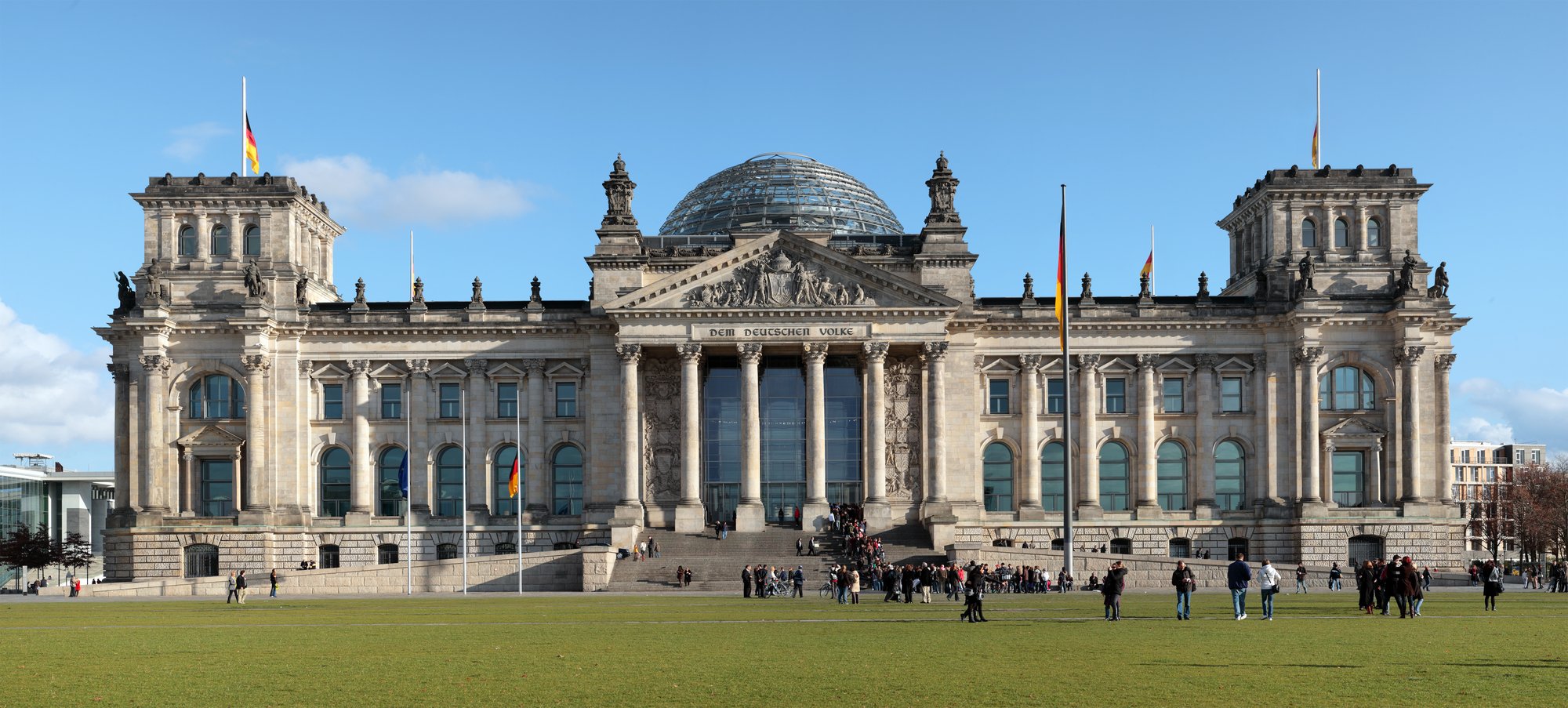 The Reichstag building seen from the west. Inscription translates to "For/To the German People".