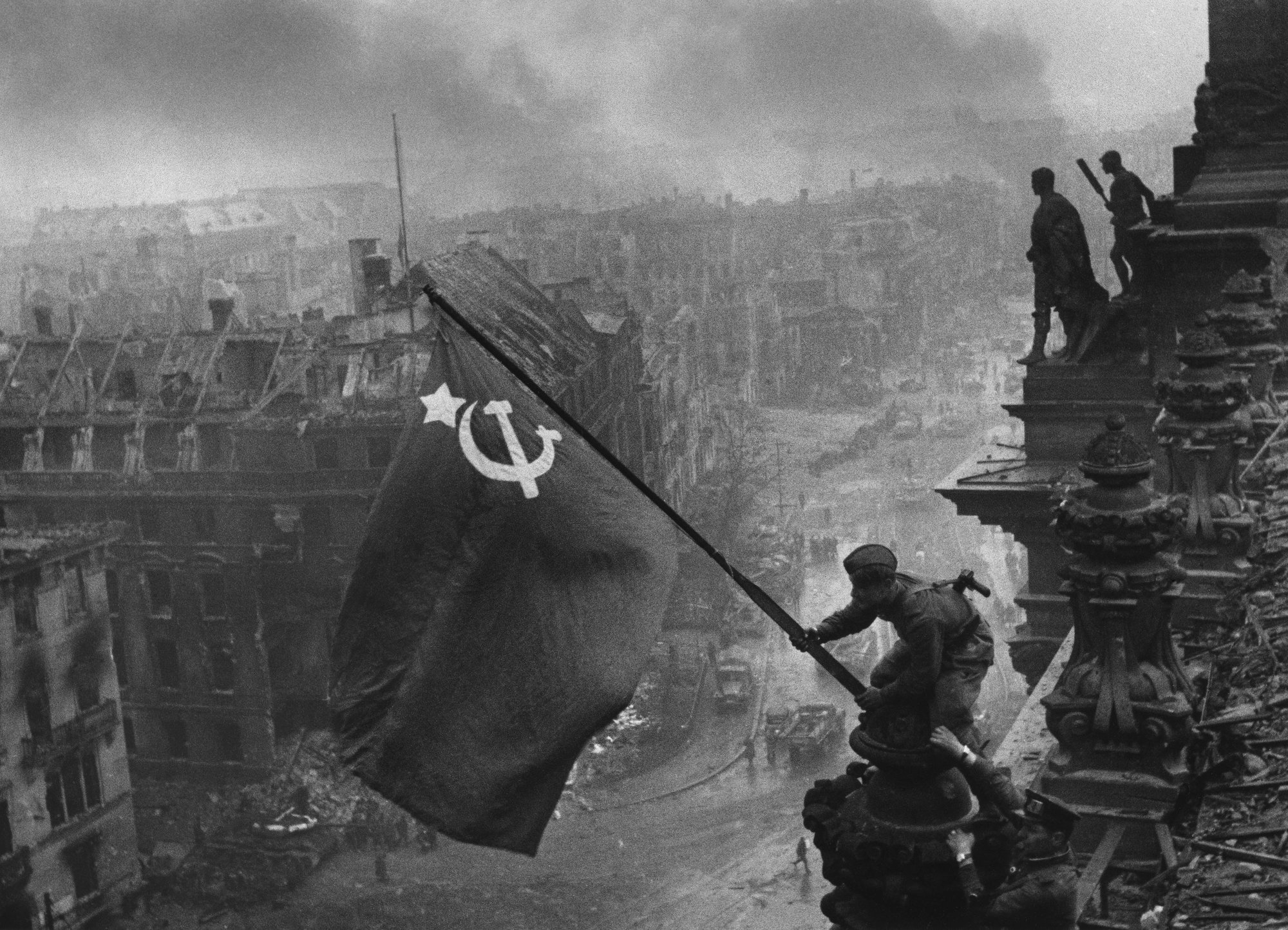 The iconic "Raising a flag over the Reichstag" photo by Yevgeny Khaldei.